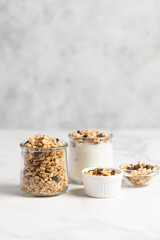 granola with chocolate, yogurt with granola in a glass jar
