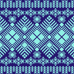 a symmetrical geometric pattern, predominantly in blue and light green. The design features intricate diamond shapes, lines, and repeating motifs inspired by traditional art. Vector geometric ethnic.