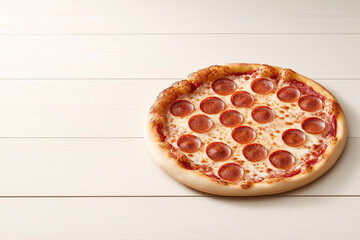 Perfectly baked pepperoni pizza on rustic wooden table, space for text