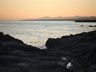 sunset over the sea and mountain