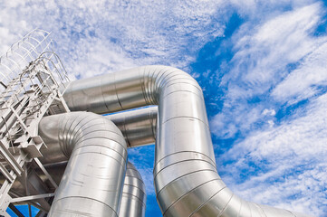 pipeline against blue sky and clouds, view from below