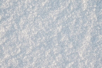 gray background, photo shows texture of white snow close-up