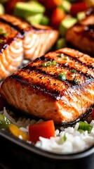 Grilled salmon fillet on rice with vegetables
