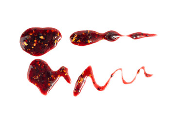 Black currant jam with chili isolated, blueberry chilli pepper marmalade smear, spicy fruit confiture