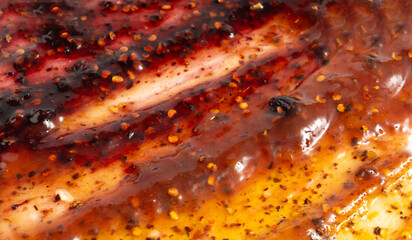 Fototapeta premium Color jam with chili, chilli pepper marmalade smear mix, spicy fruit jelly fruity confiture smudge