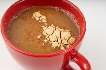 Maca powder drink isolated, dry Peruvian ginseng beverage, powder in water, ground ayak willku tea