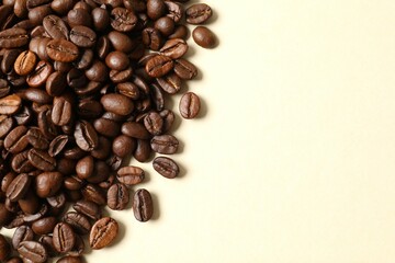 Coffee beans on color background