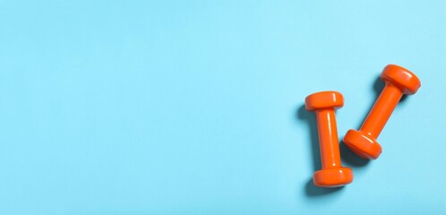 Sport equipment on color background, top view