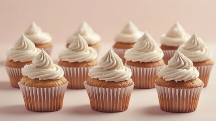 Delicious cupcakes adorned with a rich creamy swirl are neatly arranged in rows on a soft pastel background, creating an ideal area for text.