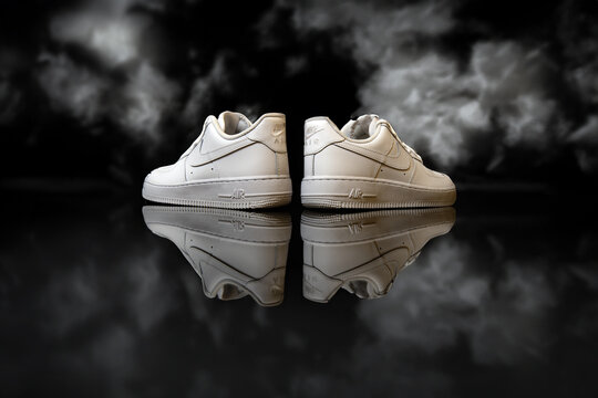 Nike Air Force One shoes on mirror scenario, studio shot