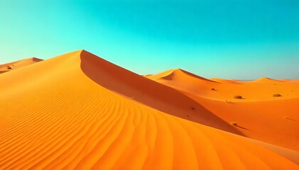 Vast orange sand dunes under a clear blue sky with small sparse green bushes create a serene desert landscape