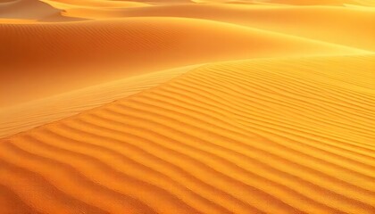 Naklejka premium Golden sand dunes of the desert under warm sunlight with intricate patterns on their surface