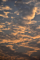 Dramatic colorful cloudscape with the sunbeam at the sunset. Sunlight through the clouds. Sunset skyscape, sunset background. Nature concept