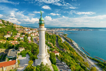 Plakat Faro della Vittoria lighthouse in Trieste city at sunny day, Italy