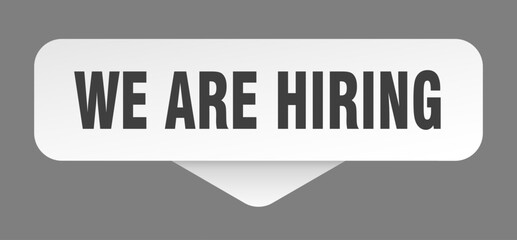 we are hiring sticker. we are hiring sign isolated on gray background