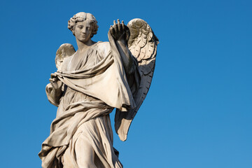 ROME, ITALY - SEPTEMBER 1, 2021: The statue of Angel with the Sudarium on the Ponte Sant'Angelo by Cosimo Fancelli (1620  - 1688).