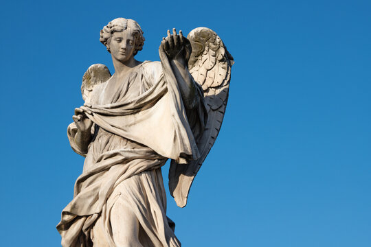 ROME, ITALY - SEPTEMBER 1, 2021: The statue of Angel with the Sudarium on the Ponte Sant'Angelo by Cosimo Fancelli (1620  - 1688).