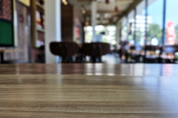 Close up Surface of Wooden Table in Cafe with Bokeh Background. (Selective Focus)