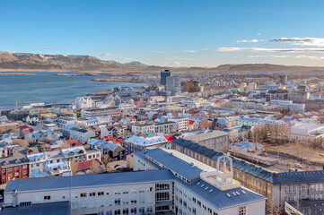Reykjav&iacute;k city skyline buildings along the coastline of the Atlantic ocean. Photo taken in Iceland on a sunny day