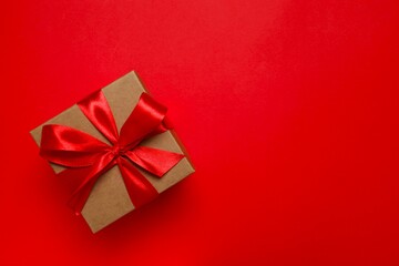 Beautiful gift box on red background