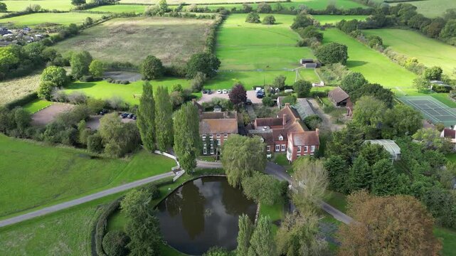 luxurious country house mansion england elegant design beautiful surroundings highlight appeal real estate opportunity circling aerial drone shot luxury property uk scenic view 