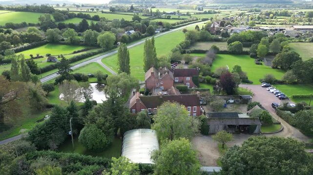 luxurious country house mansion england architecture grounds highlight elegance real estate circling backward aerial drone shot luxury property uk scenic view investment unique 