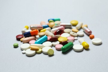 Various pills on gray background