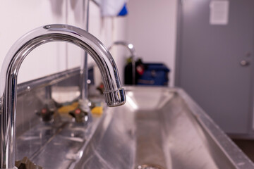 The sink is made of stainless steel and the faucet is visible.