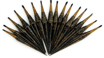 Eyeliner brushes arranged in a fan shape, each tipped with black gel.