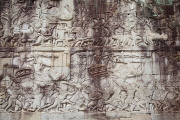 Stone-carved bas relief at Angkor, Cambodia.