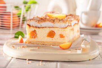 Swee and fresht cheesecake with peaches and cocoa foam.