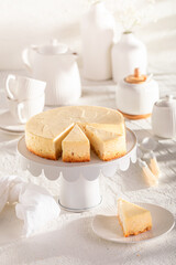 Traditional and sweet New york cheesecake served on white table.