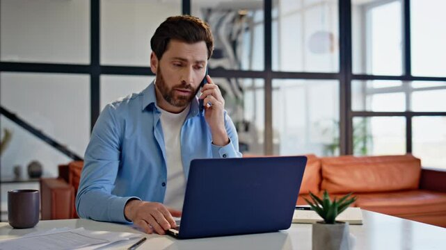 Confident boss calling mobile phone modern office closeup. Focused man talking
