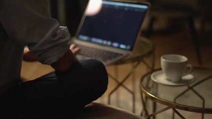 A Cozy Evening Workspace featuring a Laptop and a Cup of Coffee creates a perfect ambiance for tranquil moments of productivity and relaxation, allowing you to unwind while staying focused