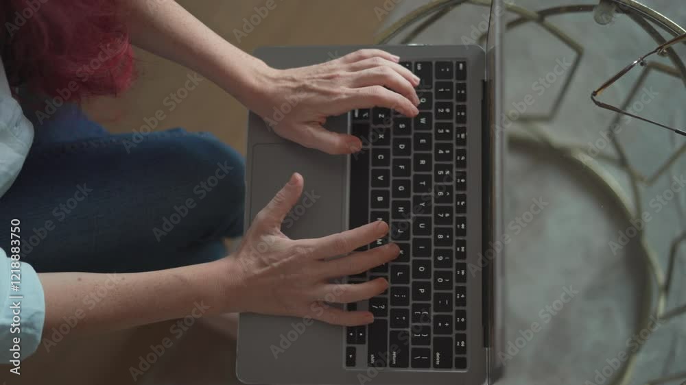 Poster a focused individual is efficiently typing away on their laptop in a relaxed home atmosphere that pr