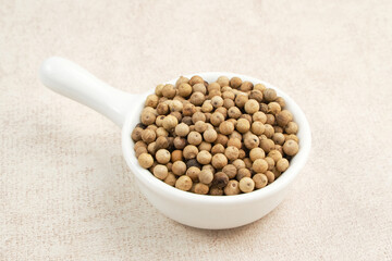 Aromatic and fresh white pepper on small bowl
