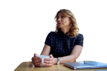 stunning mature woman at a table in a cafe drinking coffee near panoramic windows with a view of the city