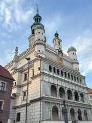 Fototapeta premium Festively decorated Christmas carousel with colorful horses and ornate lights at the Poznań Christmas Market in Poland, surrounded by holiday decorations