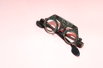 Test goggles on a pink table