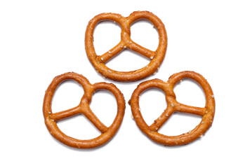 Small pretzel on white background. German traditional pastry.