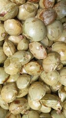 Close up fresh dogfruit jengkol at Indonesian traditional market. semur jengkol cooking ingredients food from batavia