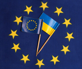 flag of ukraine and european union against the background of the eu flag Concepts of eu support for...