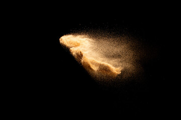 Sand flying explosion isolated on black background ,throwing freeze stop motion object design.