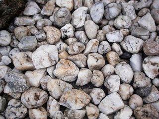 White pebbles stone for background.