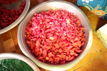 pink and red coconut jelly place them in a large stainless steel bowl.