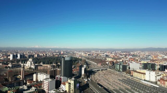 Europe, Italy, Milan 01,30,2025 drone aerial view of Garibaldi Railway station , arrive in  Milan fashion city downtown with Frecciarossa train  