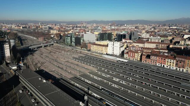Europe, Italy, Milan 01,30,2025 drone aerial view of Garibaldi Railway station , arrive in  Milan fashion city downtown with Frecciarossa train  