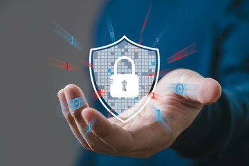 A hand holding a digital security icon, symbolizing cybersecurity, data protection, and encryption...