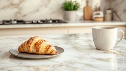 A photo of a modern kitchen with a marble countertop. There is an empty plate on the countertop, and in front of it, there's a croissant. A mug of coffee is next to the croissant. 