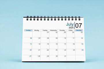 July 2025 Monthly desk calendar for 2025 year on soft blue background.